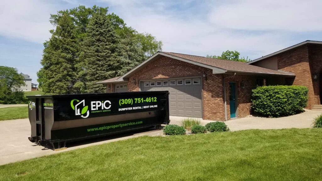 EPIC Dumpster placed on home driveway next to garage access