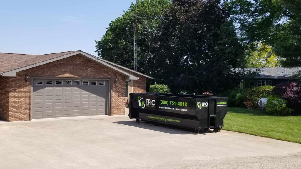 EPIC Dumpster near garage on the driveway